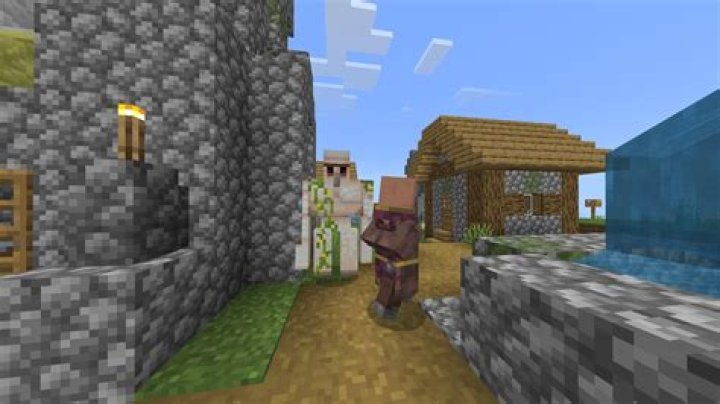 At what distance (from the player) do iron golems spawn in villages?