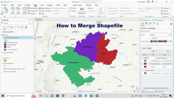 How can I merge two shapefiles with different attributes but are in the same geographic space