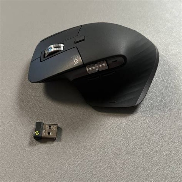 How can I use one mouse with two computers via Logitech's Unifying receiver and easy-switch technology?