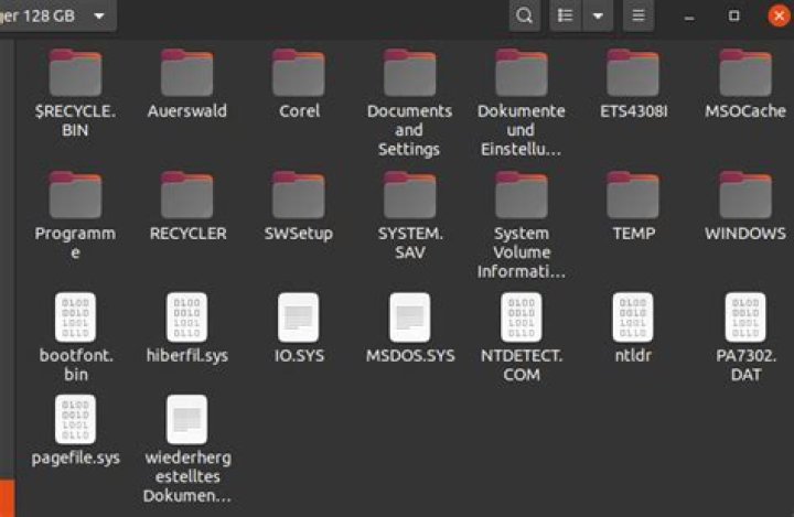 How can you tell if Windows XP is 64bit or 32bit if you only have the partition/filesystem on a hard drive?