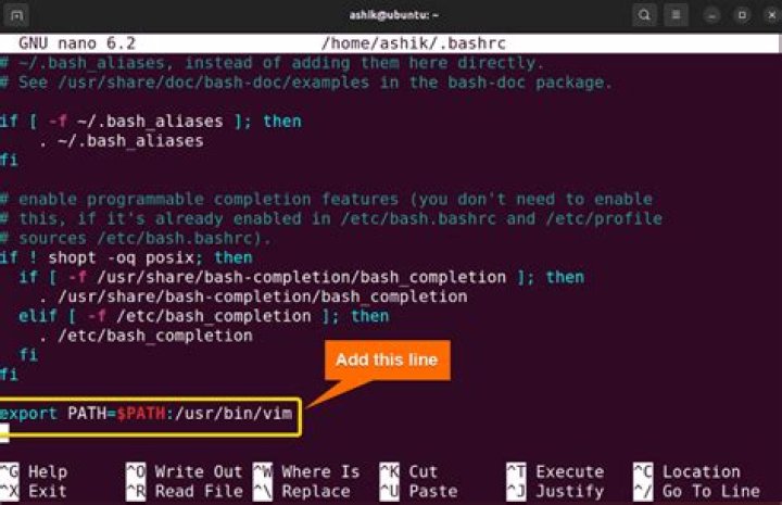 What does the export PATH line in .bashrc do?