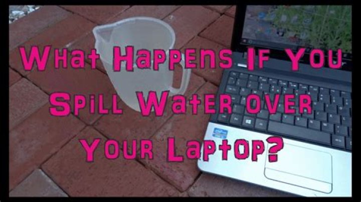 What happens when water is spilled in a powered-on PC?